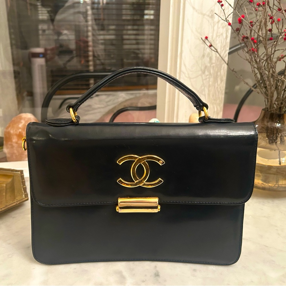 Vintage dark navy structured leather top handle handbag with brass hardware